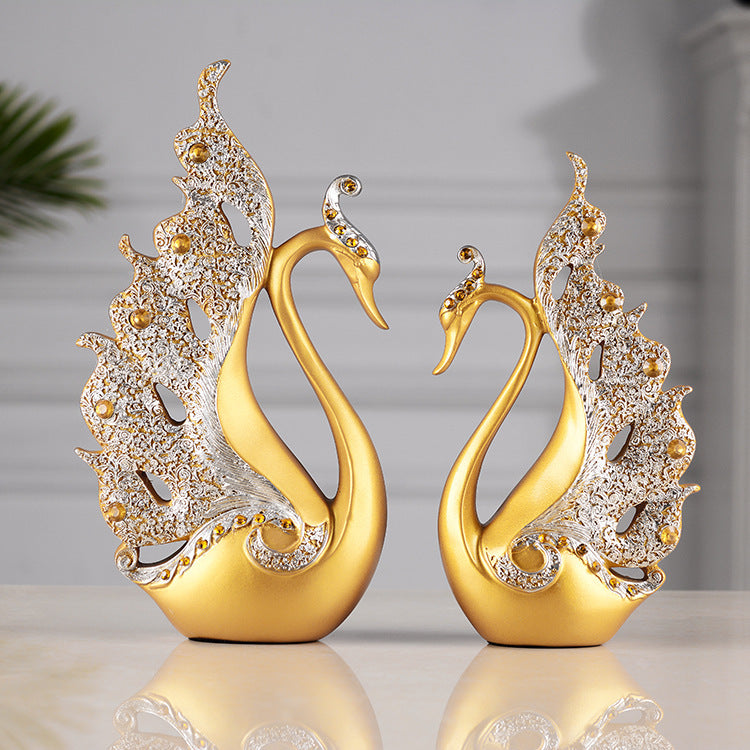 Elegant couple swan home decoration in golden finish, symbolizing love and beauty, perfect for home decor.