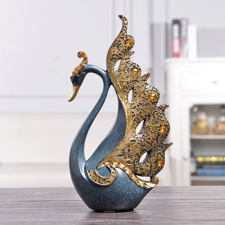 Elegant decorative swan sculpture in blue and gold, perfect for home decor and adding charm to any space.