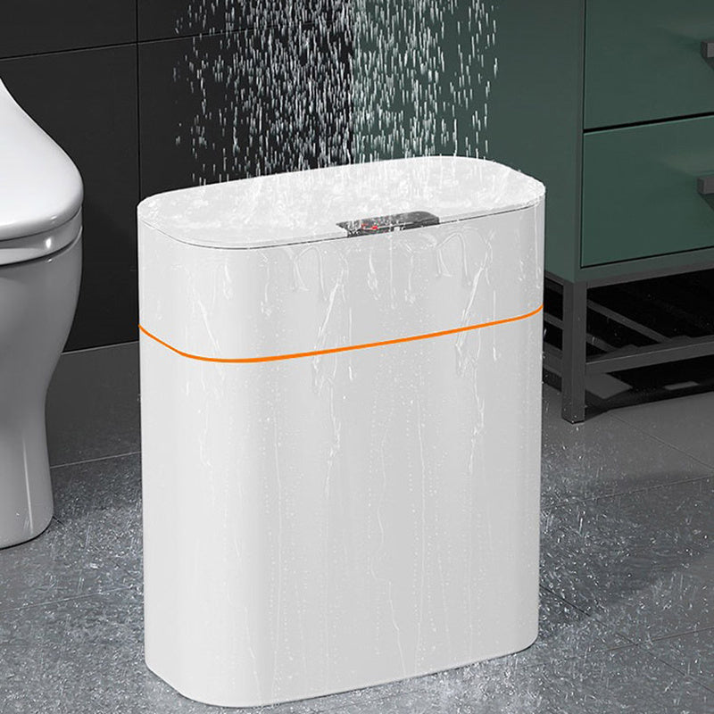 Smart touchless trash can with lid in a bathroom, designed for mess-free waste disposal and modern convenience.