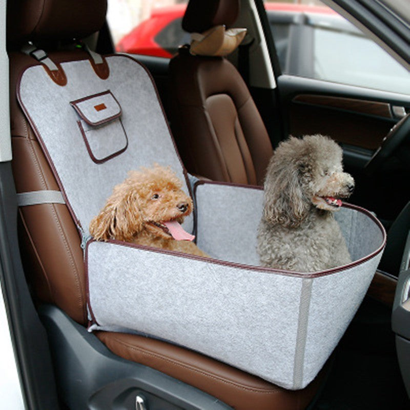 Retro dual-purpose pet car mat front seat cushion with adjustable straps and storage pocket, waterproof nylon design with two small dogs inside.