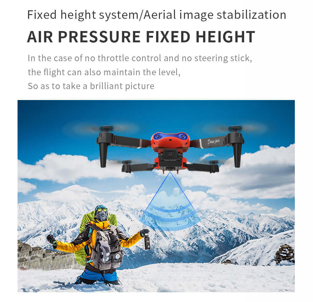 E99 Smart Camera Drone in flight with air pressure fixed height feature over a snowy mountain landscape.
