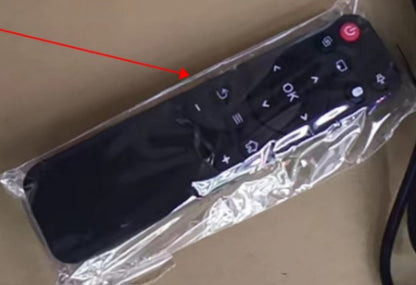Remote control for a projector, enclosed in plastic packaging, showcasing buttons for operation.